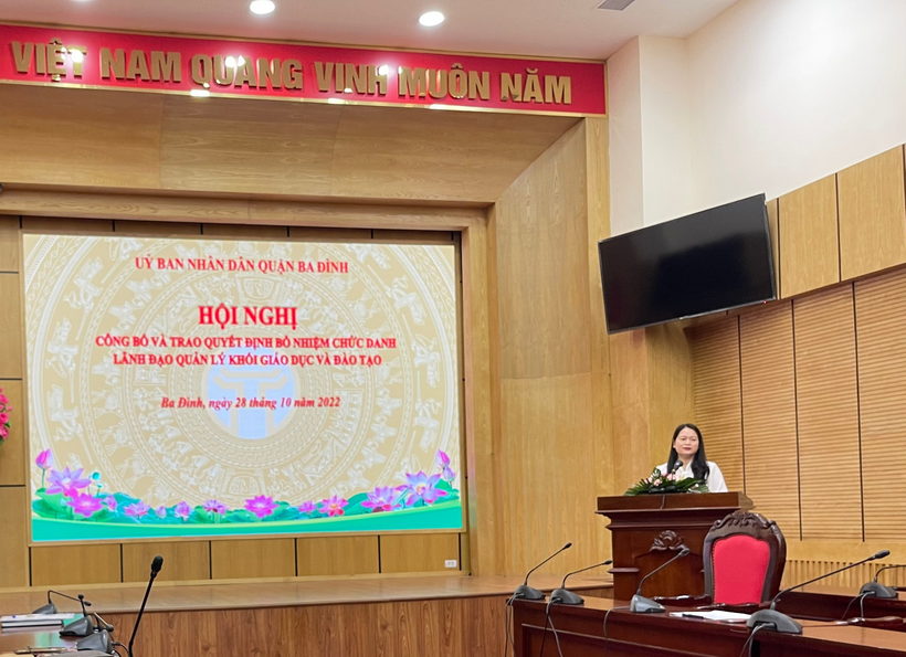 A person at a podium in front of a large screen

Description automatically generated with low confidence