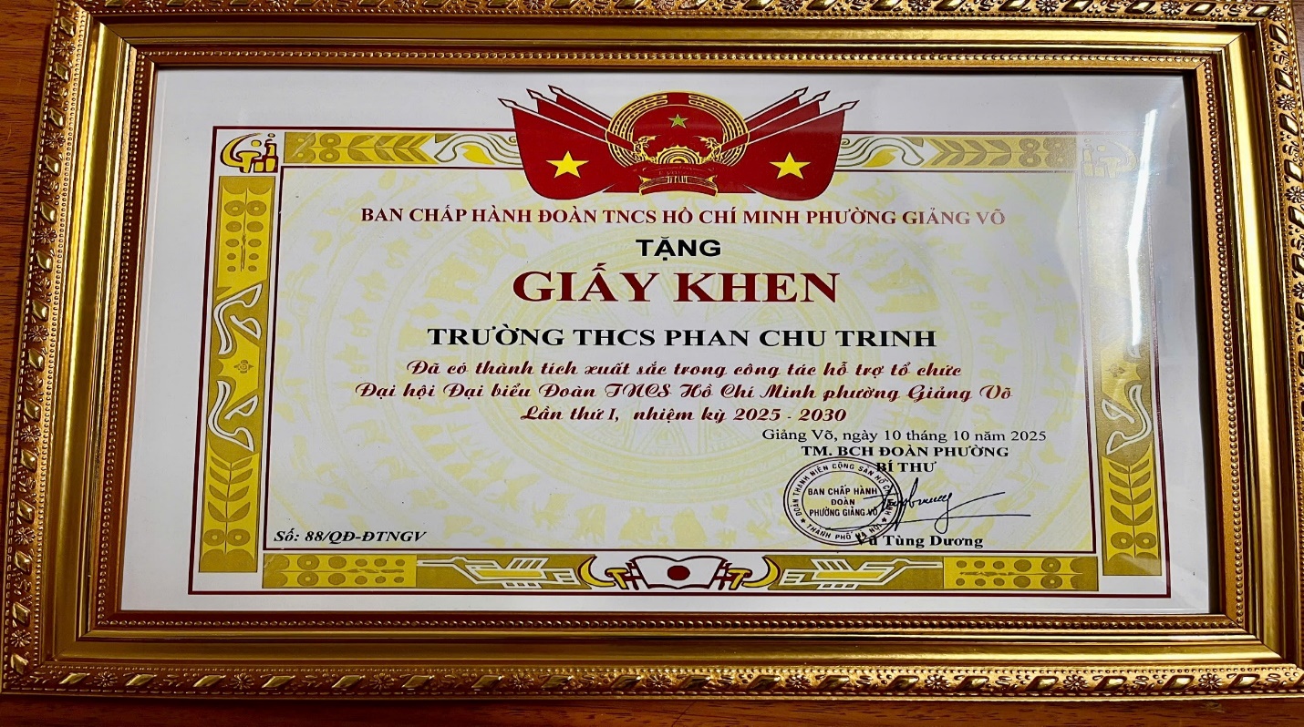 A framed certificate of a company
AI-generated content may be incorrect.