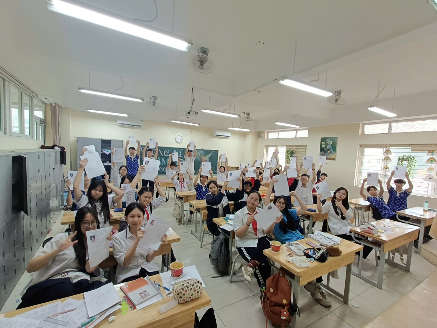 A group of people in a classroom holding up paper

AI-generated content may be incorrect.