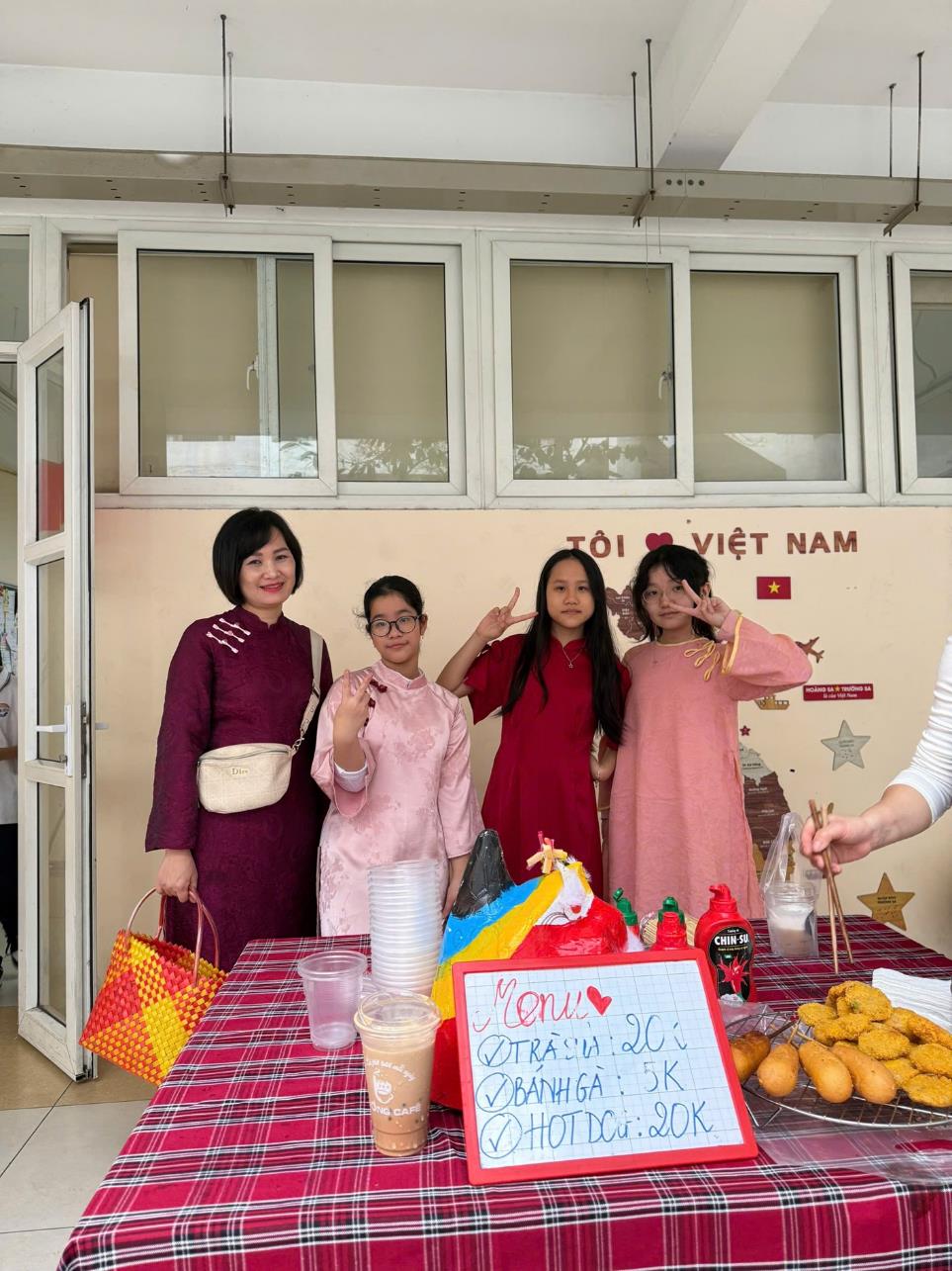 A group of people standing in front of a table with food

AI-generated content may be incorrect.