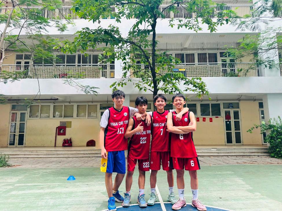 A group of boys in uniform standing on a basketball court

AI-generated content may be incorrect.