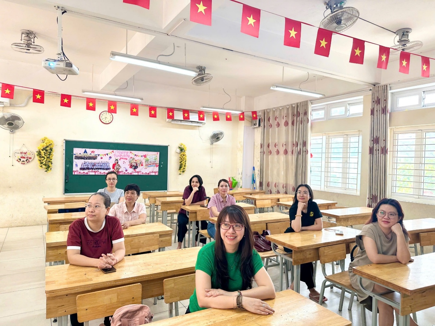 A group of people sitting at desks in a classroom

AI-generated content may be incorrect.