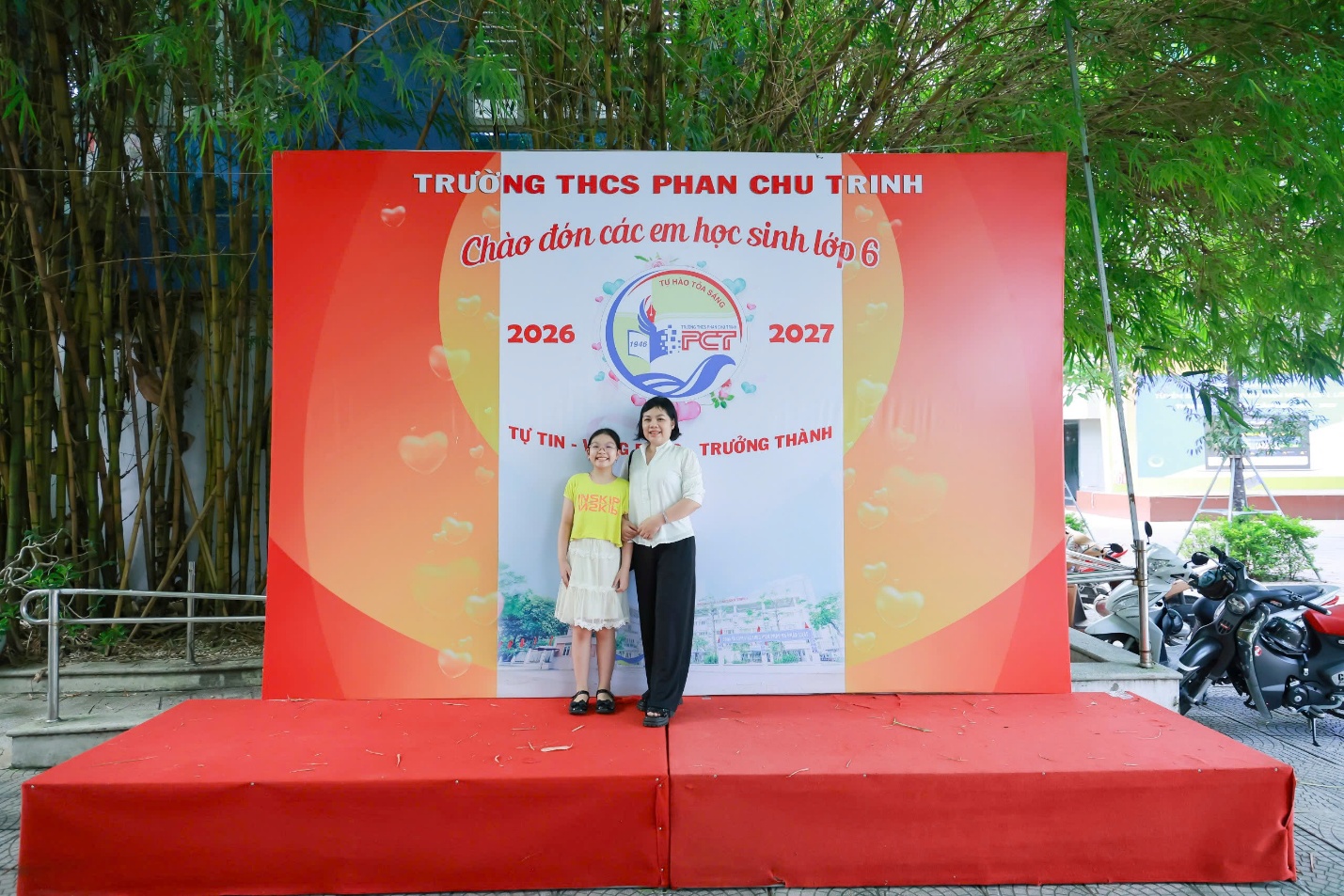 A person and a child posing in front of a large signAI-generated content may be incorrect.