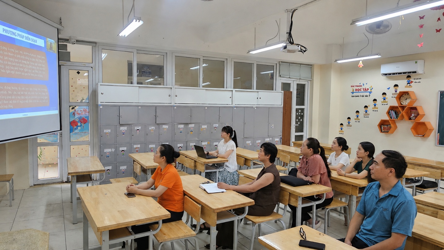 A group of people sitting at desks in a classroom

AI-generated content may be incorrect.