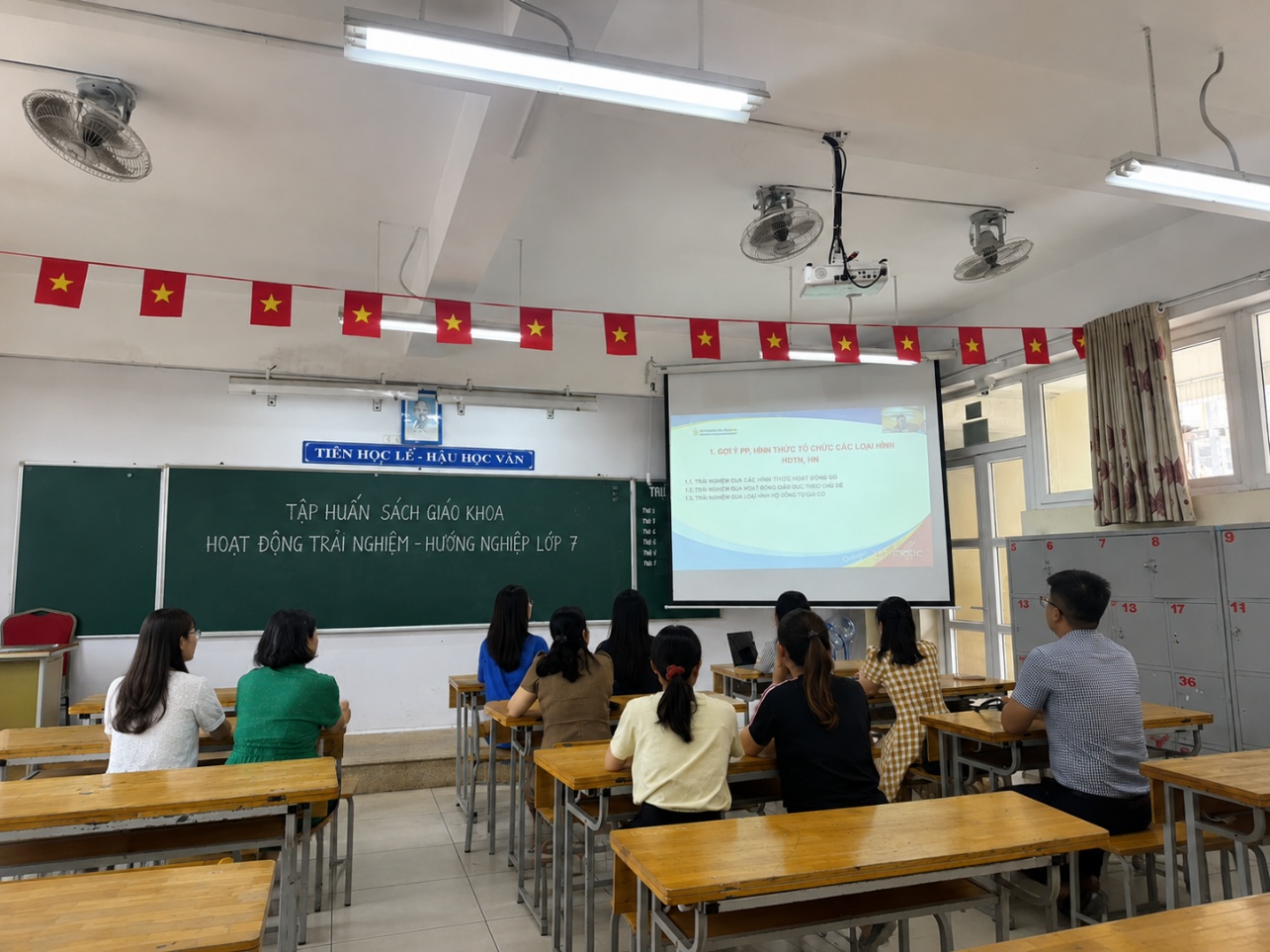 A group of people sitting in a classroom